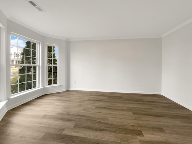 unfurnished room featuring baseboards, visible vents, ornamental molding, and dark wood-style flooring