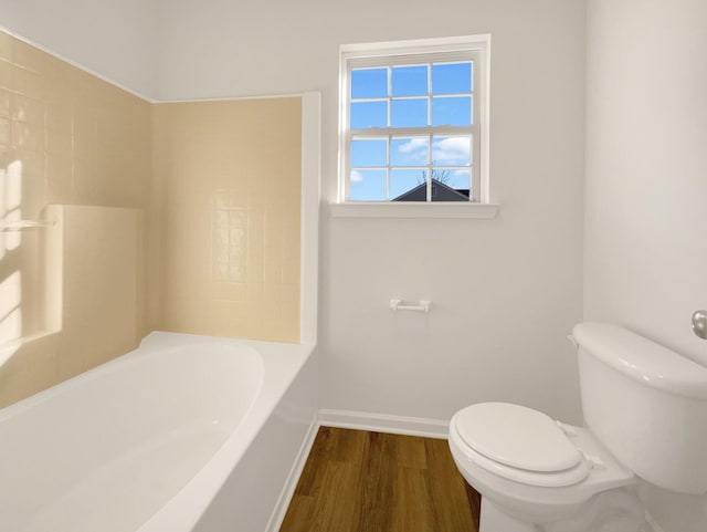 full bathroom featuring wood finished floors, toilet, and baseboards