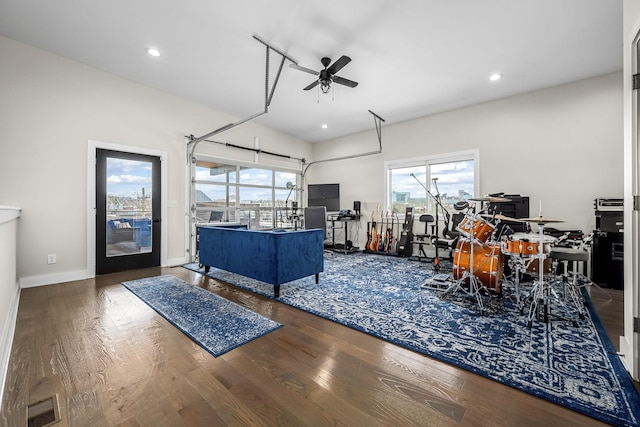 living room featuring wood finished floors, visible vents, and recessed lighting