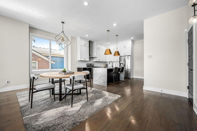 dining room featuring baseboards, dark wood-style flooring, and recessed lighting