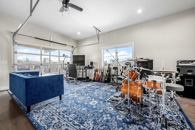 interior space featuring ceiling fan, dark wood finished floors, a garage, and recessed lighting