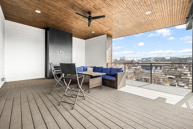 deck featuring ceiling fan and outdoor lounge area