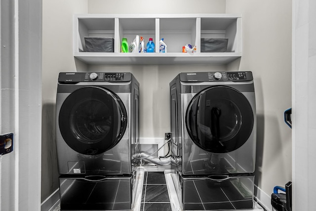 laundry room with washer and dryer, laundry area, and baseboards