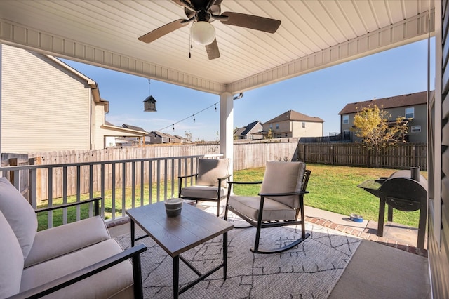 view of patio / terrace with outdoor lounge area, a fenced backyard, and a ceiling fan