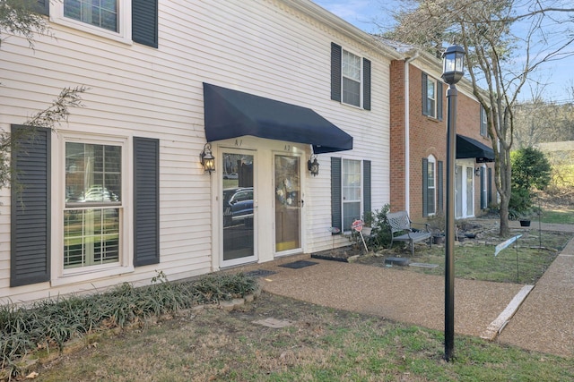 view of front of home with brick siding