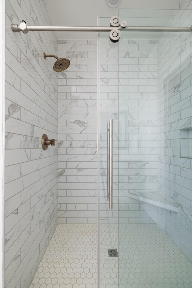 bathroom with a shower stall