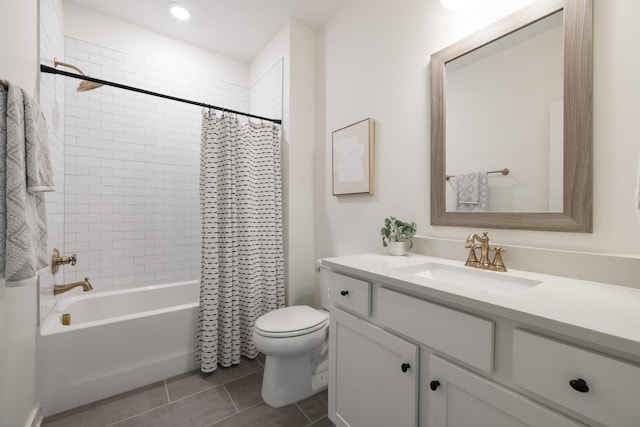 bathroom featuring vanity, shower / bath combo with shower curtain, toilet, and tile patterned floors