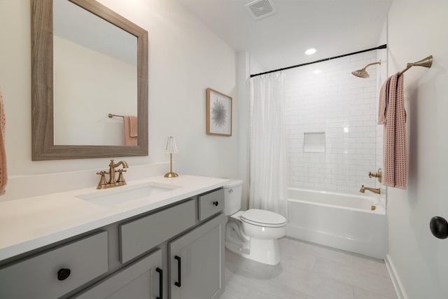 bathroom with tile patterned flooring, toilet, vanity, visible vents, and shower / tub combo with curtain