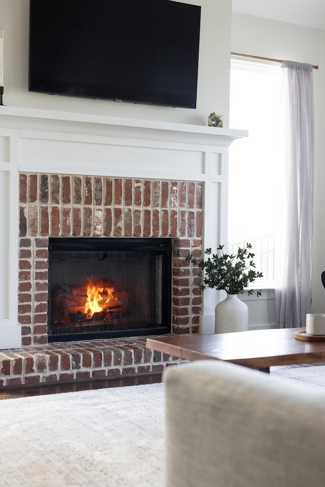 room details featuring a brick fireplace