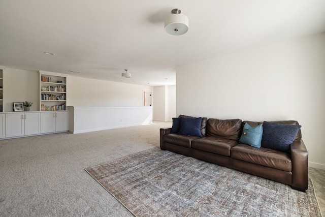 living area with carpet flooring and baseboards