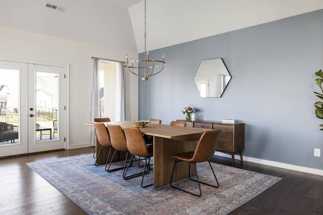 dining room with lofted ceiling, a healthy amount of sunlight, visible vents, and french doors