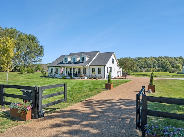 view of front of house with a porch, a front yard, and fence