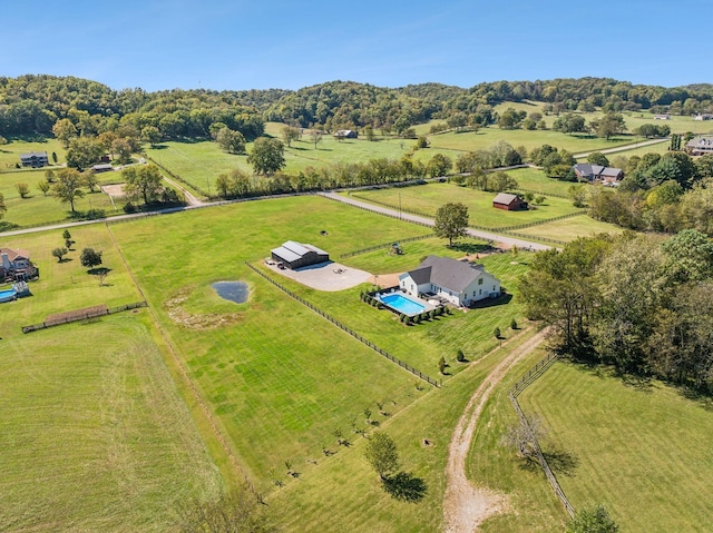 birds eye view of property with a rural view