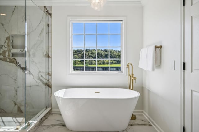 bathroom featuring baseboards, marble finish floor, ornamental molding, a soaking tub, and a marble finish shower