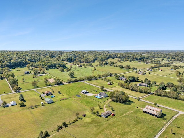 birds eye view of property with a rural view