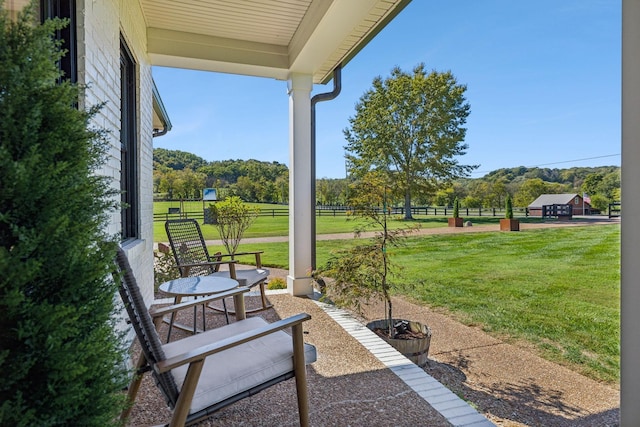 view of patio / terrace featuring fence