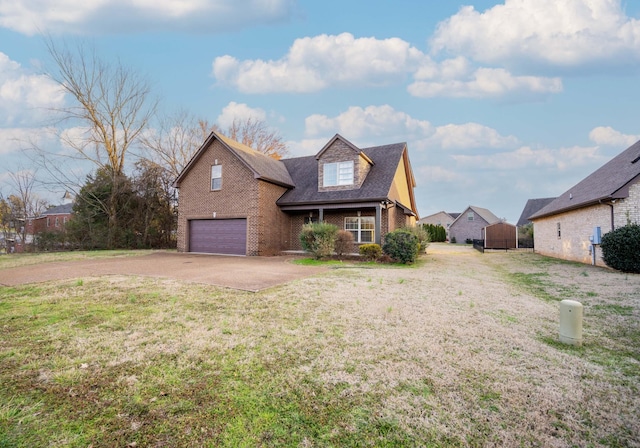 view of front facade with brick siding, a shingled roof, an attached garage, a front yard, and driveway