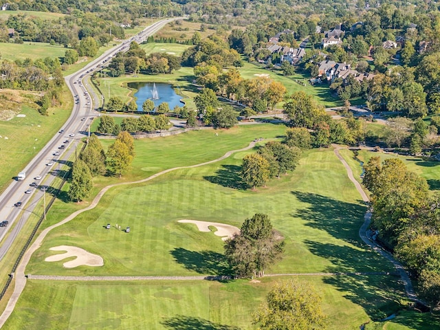 drone / aerial view featuring a water view and golf course view