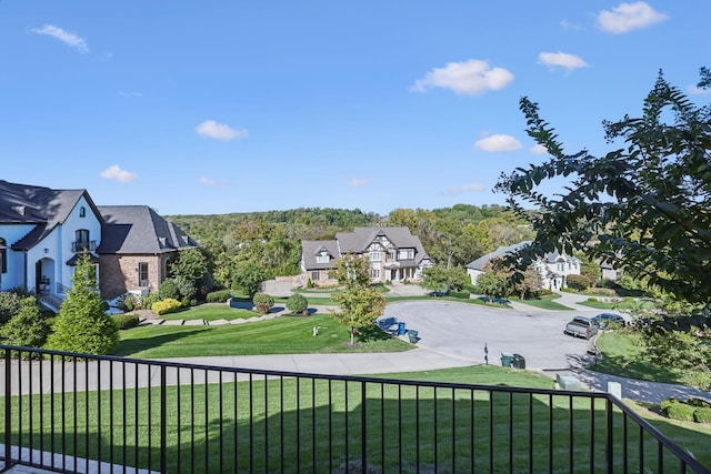 view of yard featuring a residential view and fence