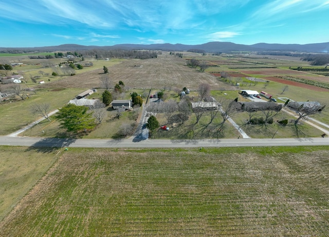 birds eye view of property with a rural view and a mountain view