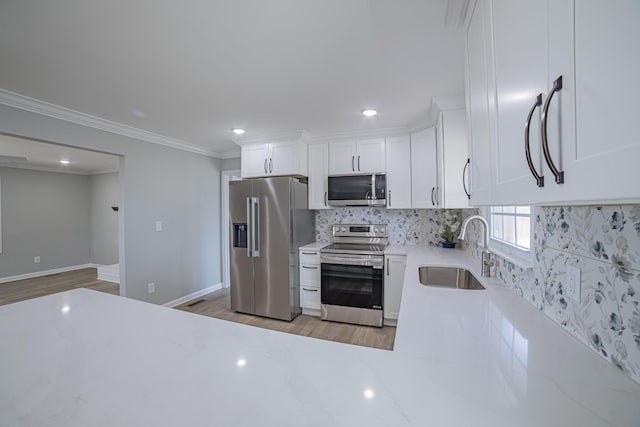 kitchen with decorative backsplash, appliances with stainless steel finishes, light countertops, crown molding, and a sink