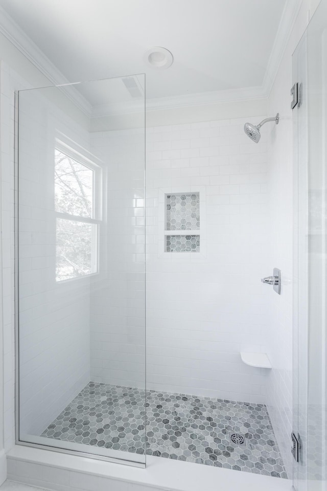 full bath featuring a stall shower and crown molding