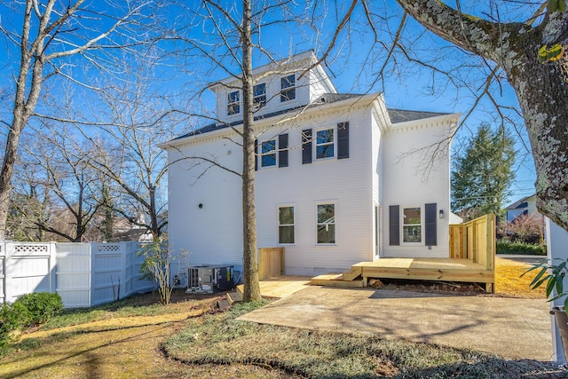 back of property with a patio, central AC, fence, crawl space, and a wooden deck