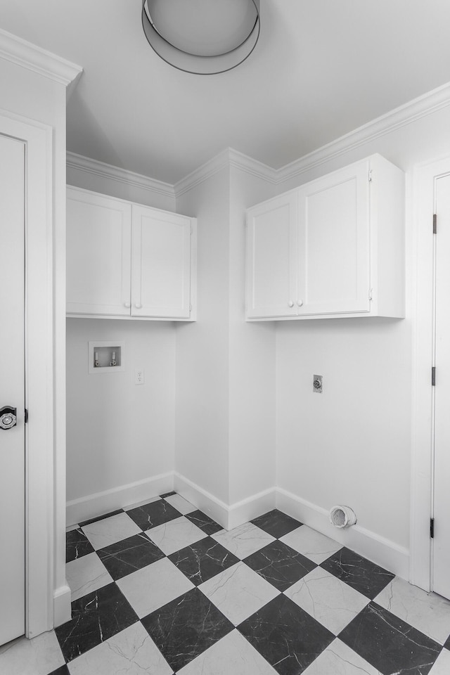 washroom featuring cabinet space, washer hookup, and crown molding