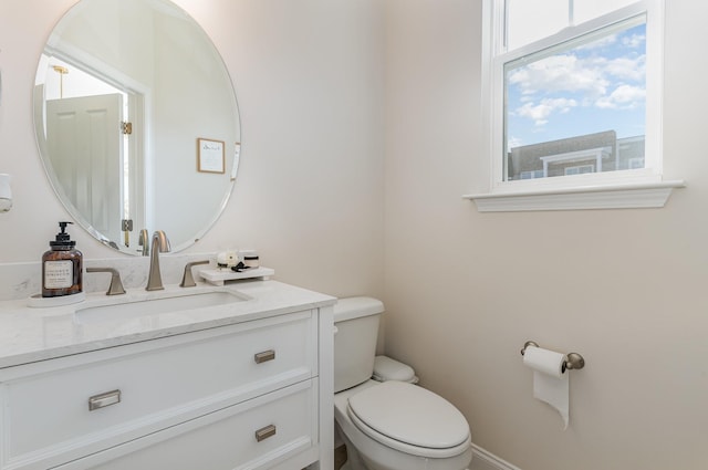 half bath with vanity and toilet