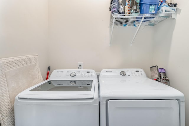 laundry area with laundry area and washer and clothes dryer