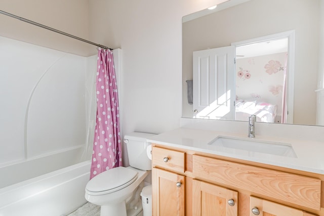 bathroom with shower / bath combo, vanity, and toilet