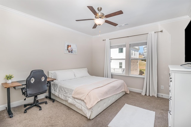 bedroom featuring ornamental molding, visible vents, light carpet, and baseboards