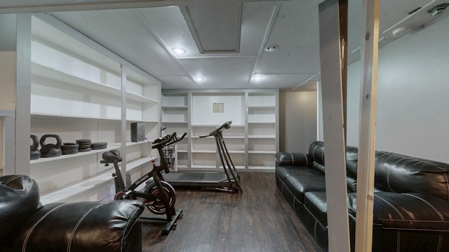 workout room featuring dark wood-style flooring