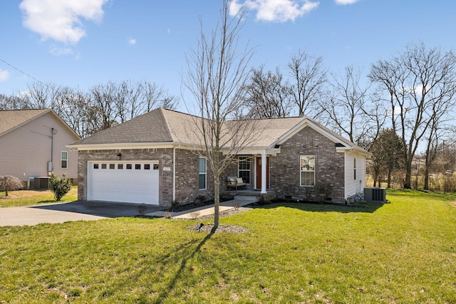 ranch-style home with an attached garage, driveway, central AC unit, and a front yard