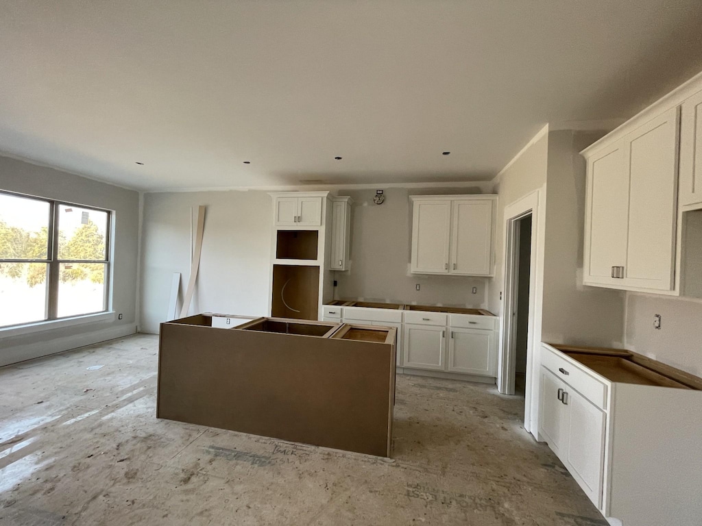 kitchen featuring a center island and white cabinets