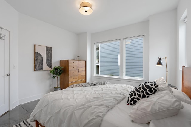 bedroom featuring baseboards