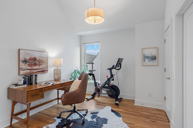 home office with light wood finished floors and baseboards