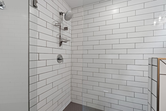 full bathroom with a tile shower