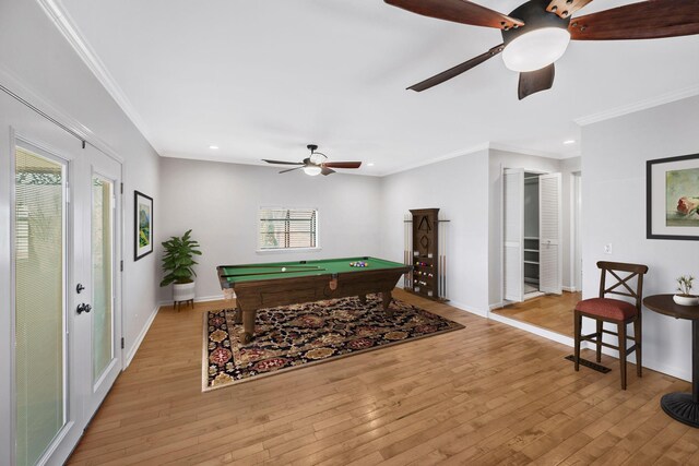 playroom with ornamental molding, light wood-type flooring, billiards, and baseboards