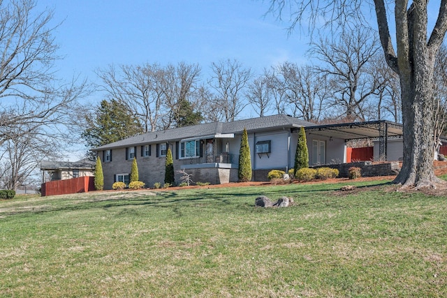 view of front of property with brick siding and a front yard