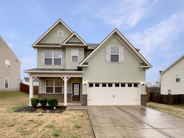 craftsman-style house featuring brick siding, covered porch, concrete driveway, an attached garage, and board and batten siding