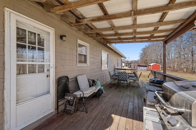 wooden deck with outdoor dining space