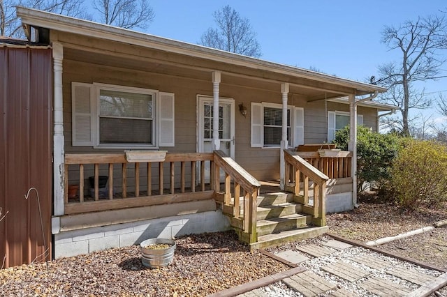 doorway to property with covered porch