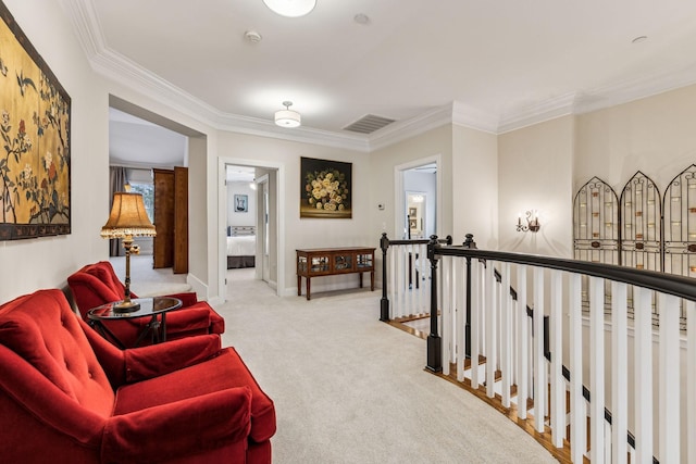 interior space featuring baseboards, visible vents, light colored carpet, crown molding, and an upstairs landing