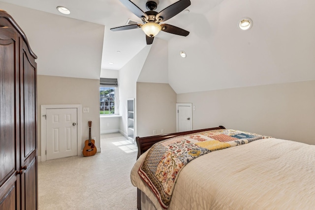 bedroom featuring light carpet, ceiling fan, vaulted ceiling, and baseboards