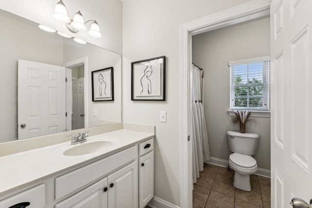 full bathroom featuring baseboards, vanity, toilet, and tile patterned floors