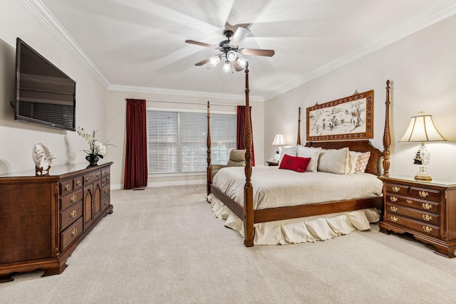 bedroom featuring ornamental molding, light carpet, and a ceiling fan