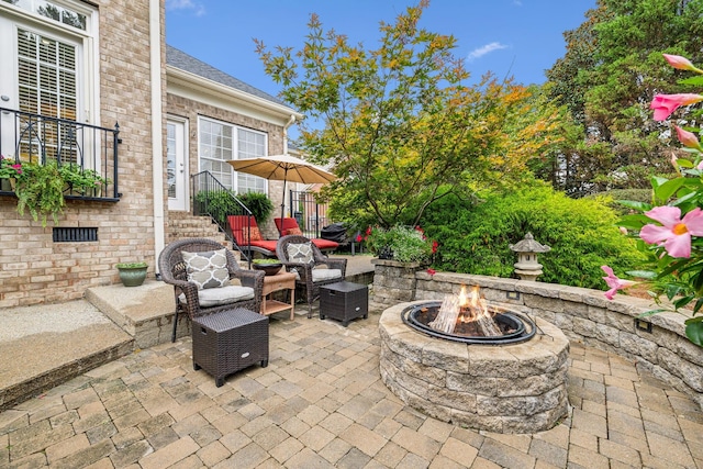 view of patio / terrace featuring a fire pit