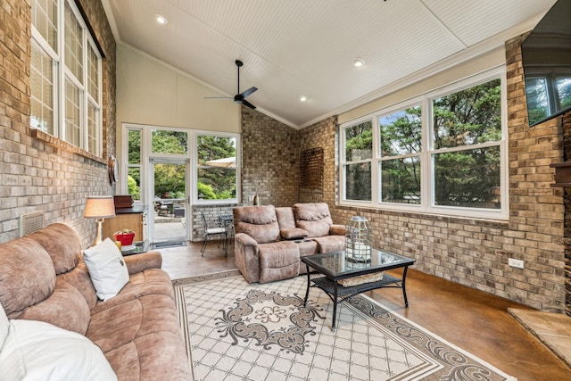 sunroom / solarium featuring lofted ceiling and ceiling fan