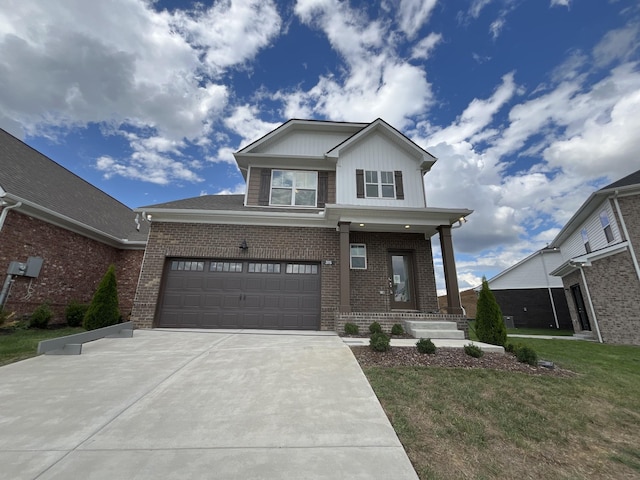 view of front of house featuring a garage, concrete driveway, brick siding, and a front yard